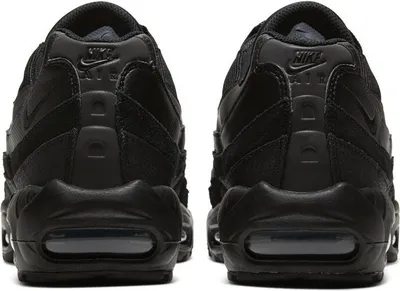 The back view of a pair of black Nike Air Max 95 Essential sneakers.