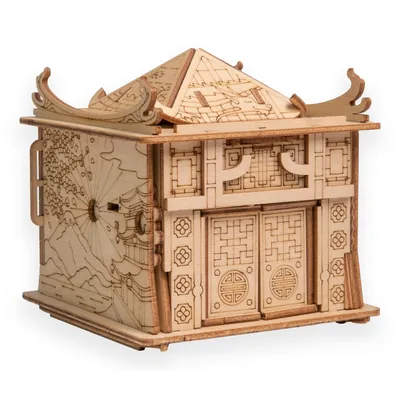 A wooden puzzle box designed to look like a traditional East Asian building.