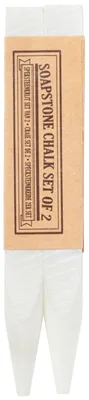 A set of two white soapstone chalk sticks, partially wrapped in a brown paper band with text.