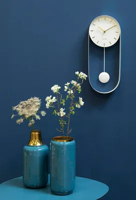 Obrázok produktu pre Dizajnové kyvadlové nástenné hodiny 5822WH Karlsson 50cm, biele hodiny