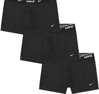 Three black Nike boxer shorts are stacked on a white background.