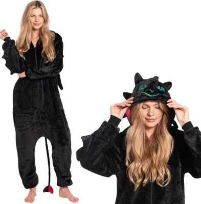 A woman is shown wearing a black dragon-themed onesie. The image is split into two views, one full body and one close-up of the hood.