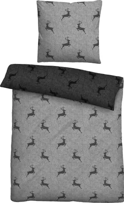 A flat lay of a pillow and a duvet cover with a deer pattern.