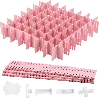 A set of pink drawer dividers, some assembled into a grid and others stacked.