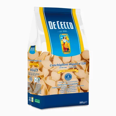 A bag of De Cecco Conchiglioni rigati pasta against a white background.