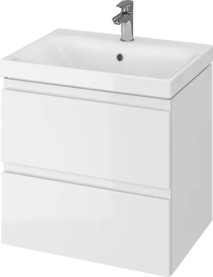 A white bathroom vanity with a sink and faucet.