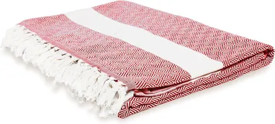 A folded red and white striped blanket with fringe.