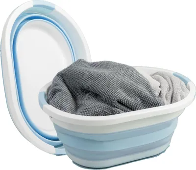 A collapsible laundry basket filled with clothes, shown against a white background.