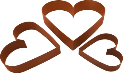 Three heart-shaped garden edging pieces are arranged on a white background.