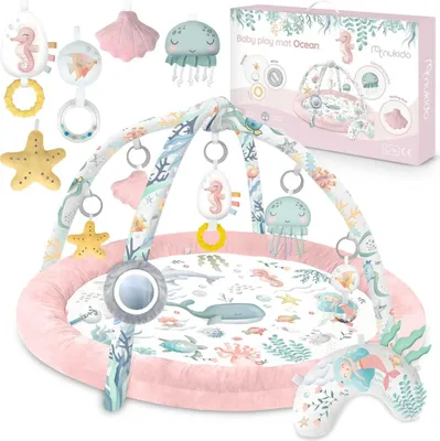 A baby play mat with an ocean theme, featuring various sea creatures and accessories, displayed with its packaging.