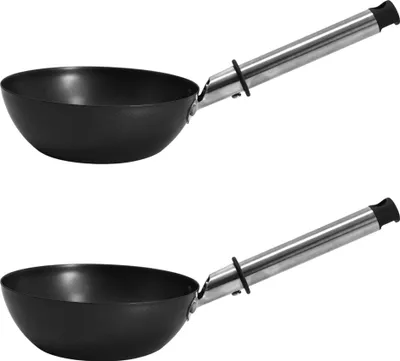 Two black woks with silver handles are shown against a white background.