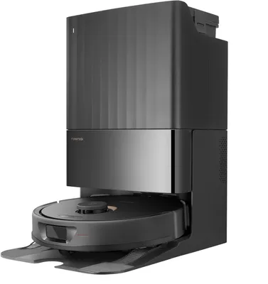 A black and gray robot vacuum cleaner docked in its charging station, presented on a white background.