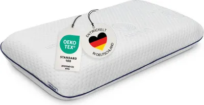A white pillow with tags attached.