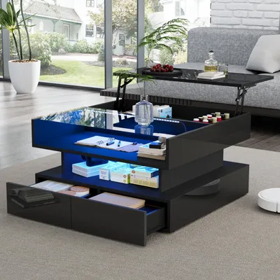 A modern living room with a black hydraulic coffee table with LED lighting, a sofa, and a large window overlooking a garden.