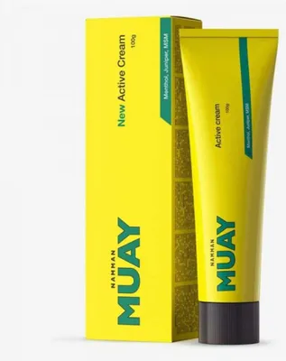 A product shot of a tube of cream and its box, both predominantly yellow with green accents.