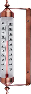 A thermometer with copper accents mounted on a wall bracket.