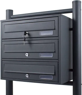 A dark gray, multi-compartment mailbox system mounted on two posts.