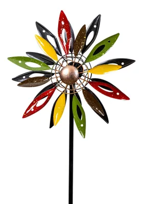 A decorative metal garden stake shaped like a colorful flower.