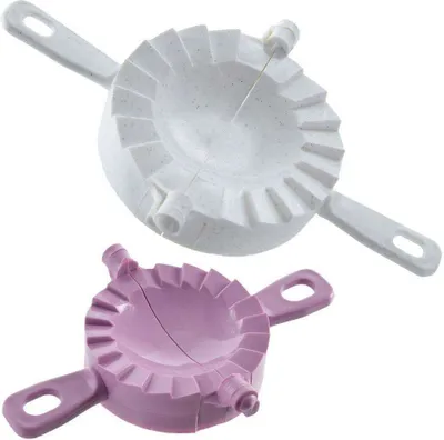 Two dumpling molds, one white and one purple, are shown against a white background.