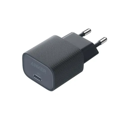 A black Anker USB-C charger with two prongs for a wall outlet.