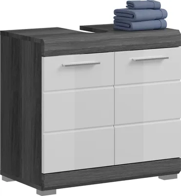 A modern bathroom vanity with a dark gray wood grain finish and white drawers, topped with a stack of blue towels.
