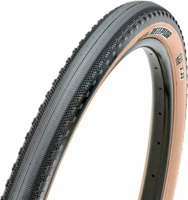 A close-up shot of a bicycle tire, showing its tread pattern and sidewall.