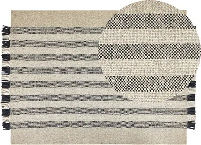 Produktbild von BELIANI Teppich Cremeweiß / Schwarz Wolle 140 x 200 cm Rechteckig Handgewebt Streifenmuster Kurzflor mit Fransen Boho Wohnzimmer Schlafzimmer Flur