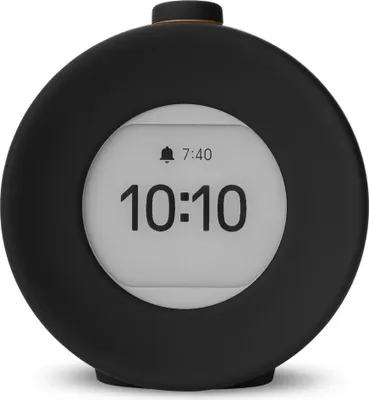 A black digital alarm clock with a white screen displaying the time.