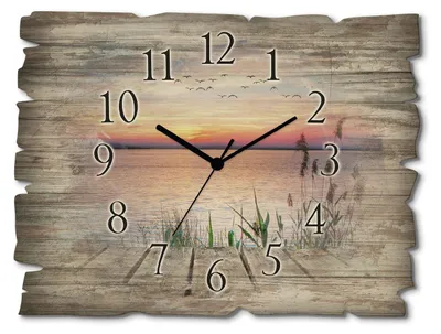 A wooden wall clock with a scenic sunset over a lake and reeds.