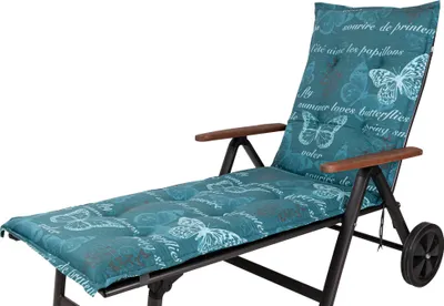 A teal chaise lounge cushion with a butterfly and script pattern, placed on a black metal chaise lounge frame with wooden armrests and wheels.