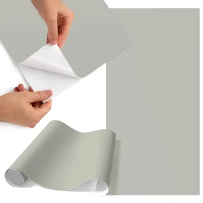 Produktbild von Möbelfolie 65x130 cm - Klebefolie Möbel - Selbstklebende Folie - Folie für Möbel - Möbelfolie Küche - Klebefolie Küche - Möbelfolie Schrank - Wasserdicht - Abwaschbar - Selbstklebend - Luftblasenfrei - Rückstandslos entfernbar - Warmes Grau