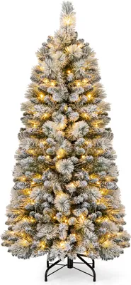 A flocked artificial Christmas tree with warm white LED lights.