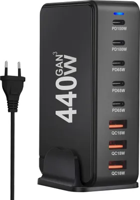 A black multi-port USB charger with a power cord is shown against a white background.