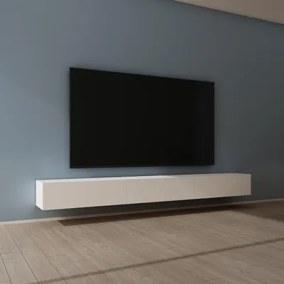 A modern living room with a wall-mounted television and a floating media console.