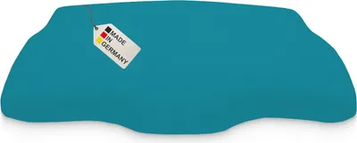 A teal-colored product with a 'Made in Germany' tag attached.