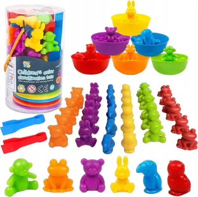 A collection of colorful sorting toys, including animal figures and bowls, arranged on a white background.