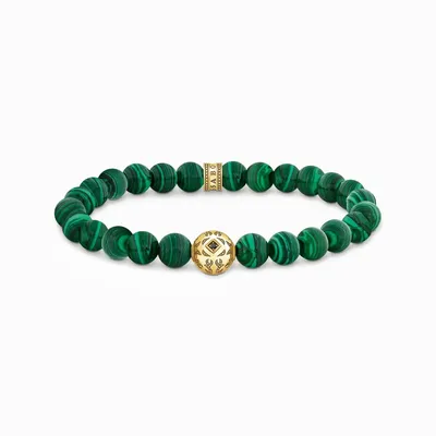 A bracelet with green beads and gold accents on a white background.