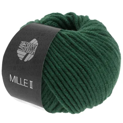 A ball of green yarn with a dark label wrapped around it.