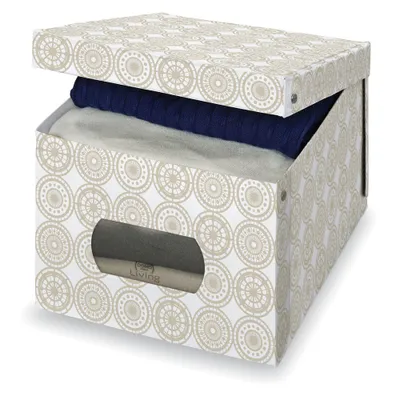 A storage box with a lid, partially open, revealing folded clothes inside. The box has a decorative pattern.