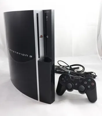 A black Sony PlayStation 3 console with a black controller and cables on a white background.