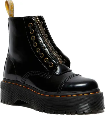 A black Dr. Martens vegan Sinclair boot with a platform sole is shown against a white background.