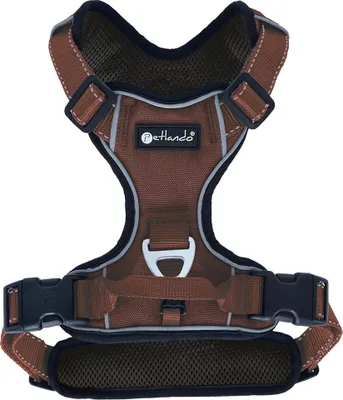 A brown dog harness is shown against a white background.