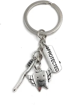 Produktbild von Onwomania Schlüsselanhänger Zahn Zahnbürste Zahnfee Protected Kauwerkzeug Pflege Metall Anhänger Charm