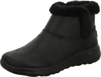 A single black boot with faux fur trim is shown against a white background.