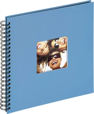 A blue spiral-bound photo album with a window on the cover showing a picture of three smiling people.