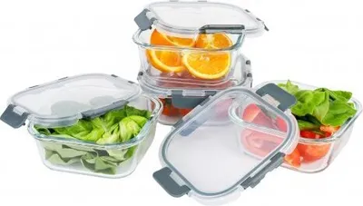 A set of glass food storage containers filled with various foods.