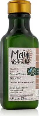 A green bottle of Maui Moisture shampoo with a gold cap, set against a white background.
