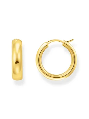 Two gold hoop earrings are displayed against a white background.