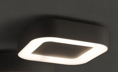 A close-up shot of a modern ceiling light fixture.