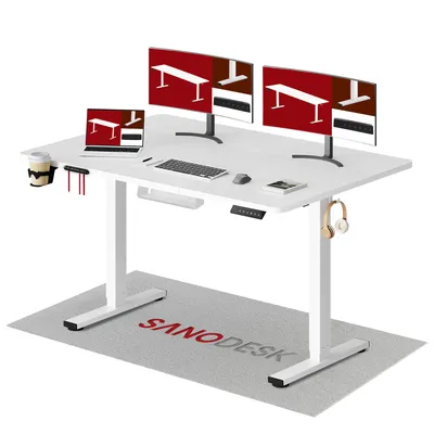 A white standing desk with dual monitors, a laptop, keyboard, mouse, and accessories, set up in a clean, modern office environment.